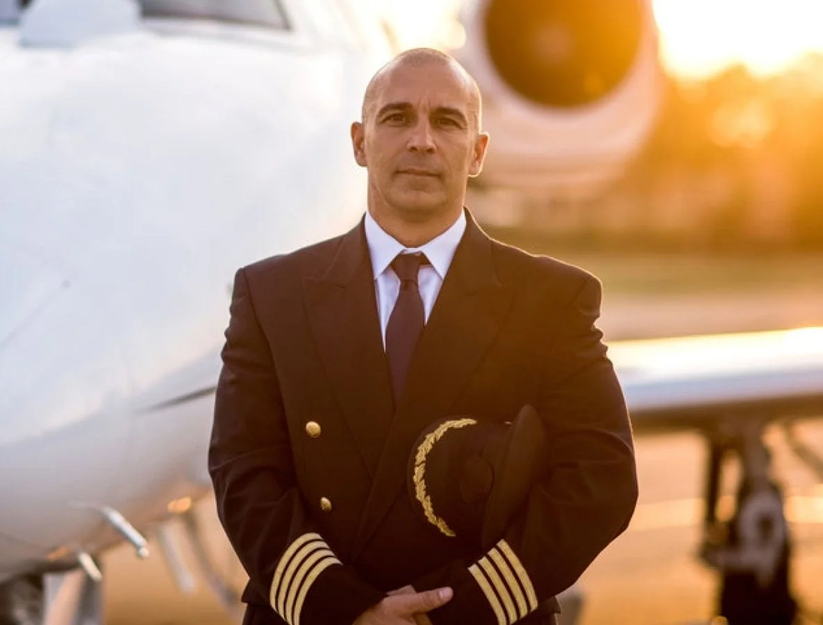 Pilot standing near aircraft